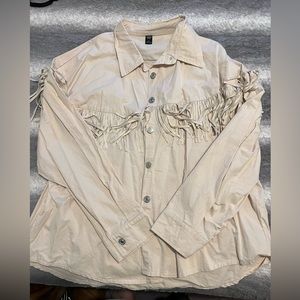 beige fringed jacket!